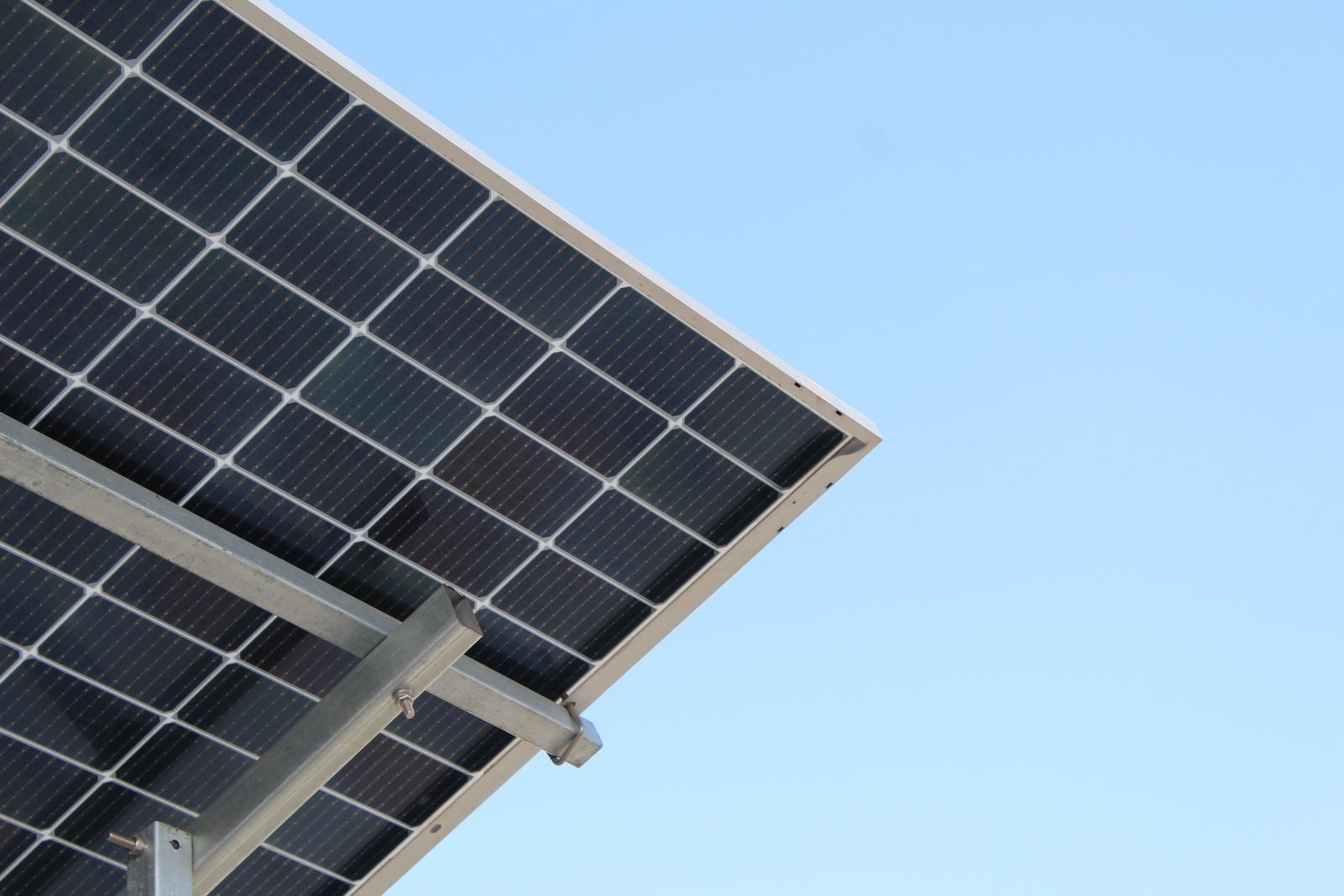 Close view of a solar panel frame against the sky
